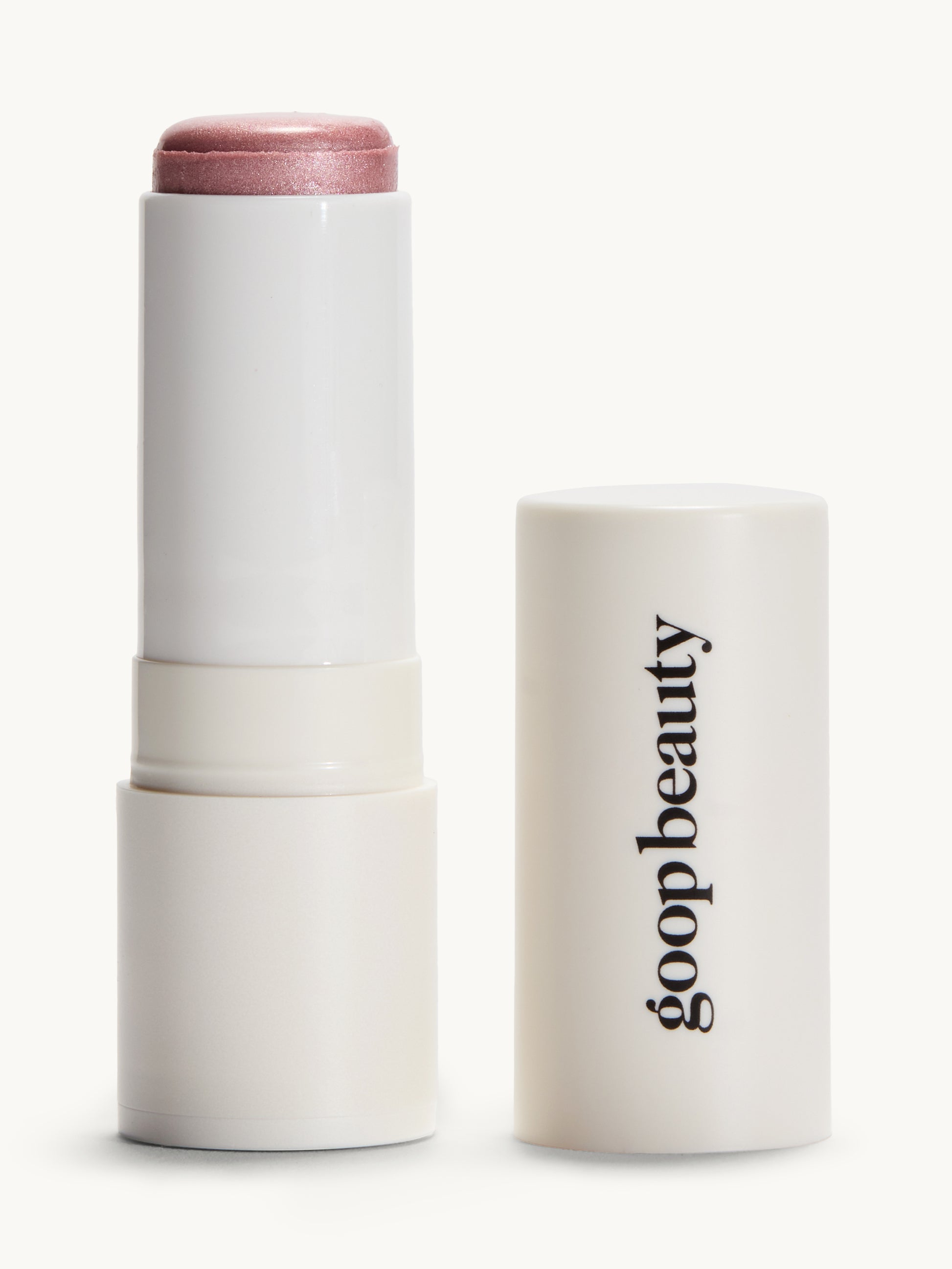 Blush balm stick with a white container labeled 'goopbeauty' on a white background