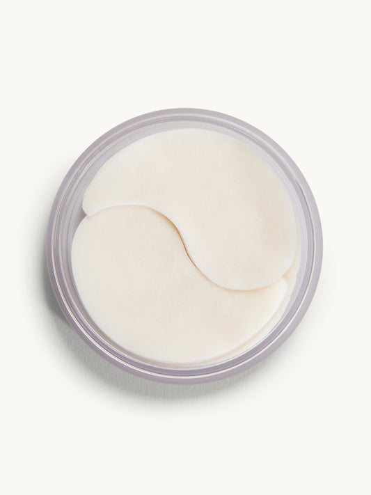 Jar of eye patches on a white background