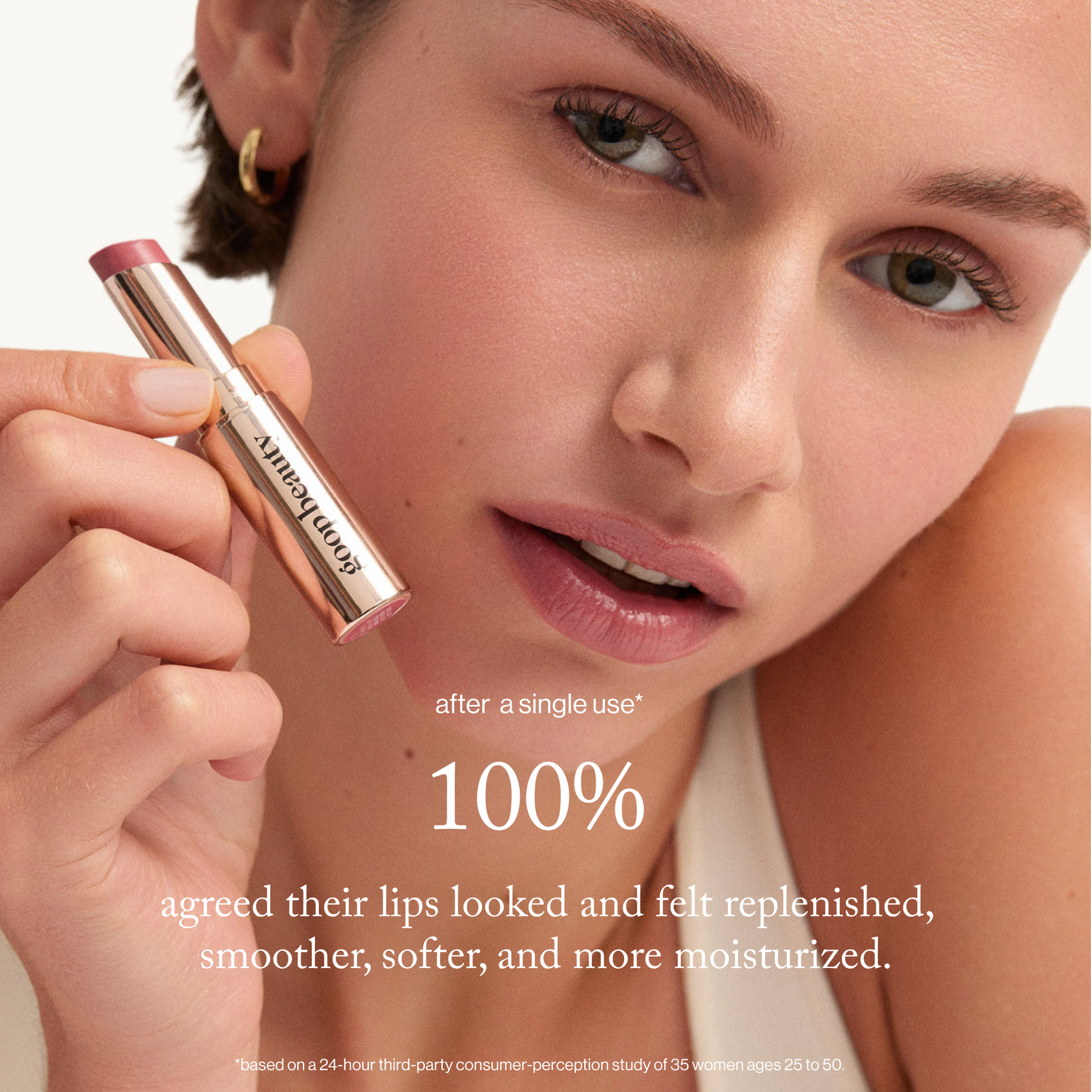 Woman holding a lipstick with text about lip care benefits on a beige background